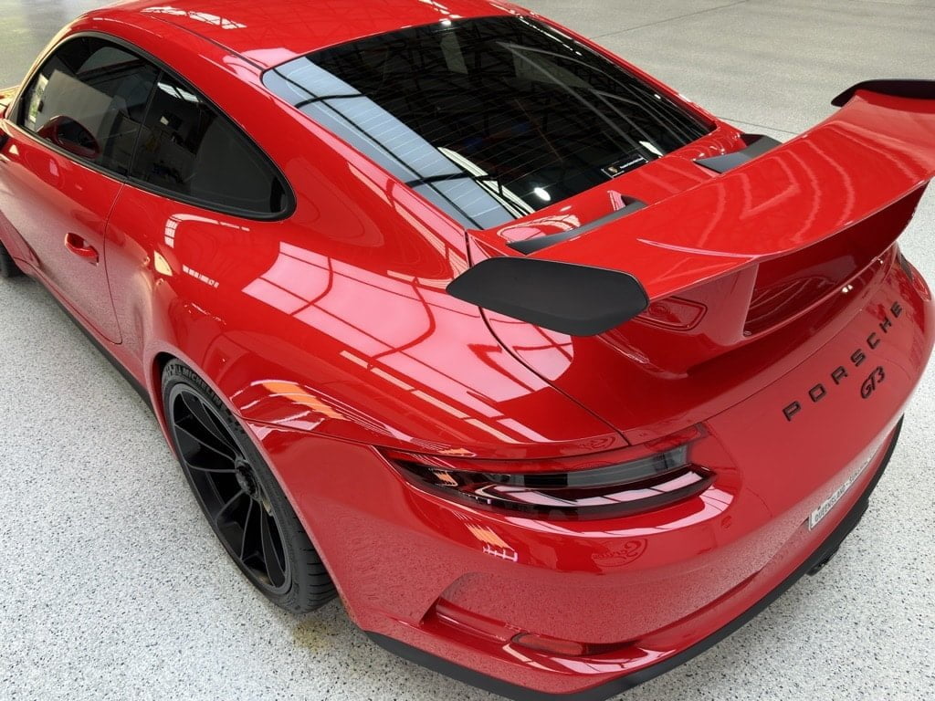 Red Porsche in detailing studio