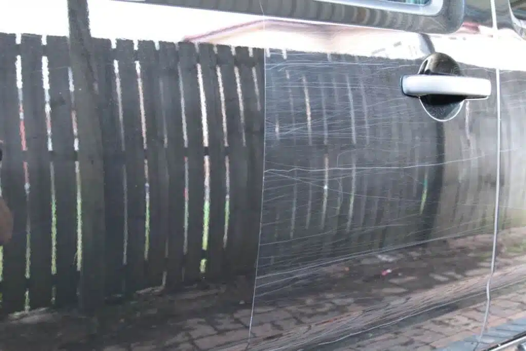 A vehicle covered in trail mark scratches requiring a cut and polish