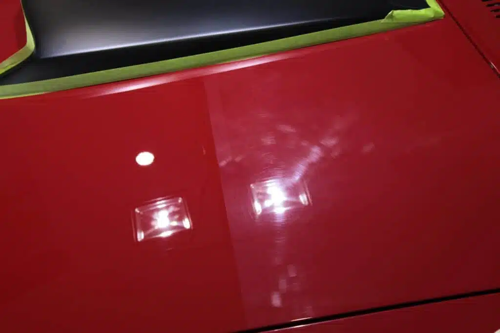 An image of a car exterior showing the colour depth you can get from having a cut and polish