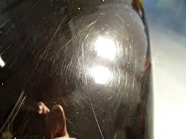 A close up of a vehicle with deep scratches